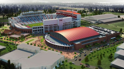 Terra Cotta colored PVDF coatings clad the curved metal roof of The Pavilion at Ole Miss